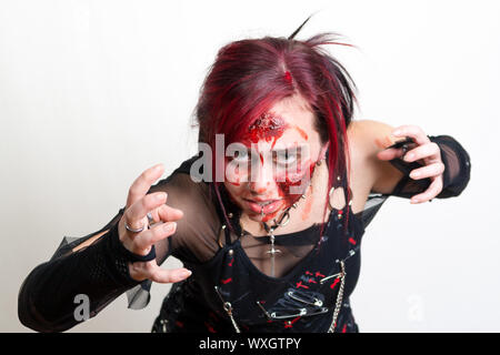 Red haired gothic girl with halloween makeup Stock Photo