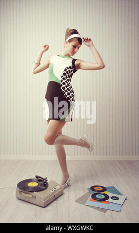 Young woman dancing at home, 1960 style Stock Photo