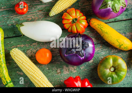 Fresh colorful organic season vegetables ingredients on rustic wooden background, top view, flat lay. Healthy, diet or vegetarian food concept. Stock Photo