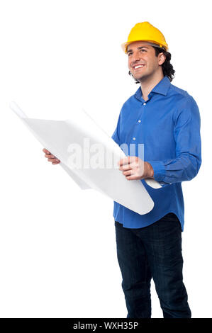 Architect with hard hat holding out construction plan Stock Photo