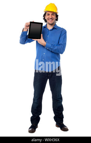 Handsome architect showing brand new tablet device Stock Photo