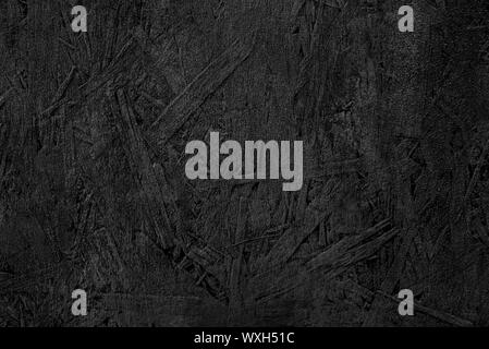 The texture of the wood particle board painted black. Stock Photo