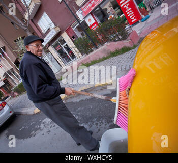 ANKARA, TURKEY – APRIL 15: Cab driver washes taxi prior to ANZAC day on April 15, 2012 in Ankara, Turkey.  Each year patriotic Turks honor those falle Stock Photo