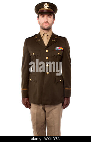Smart young army officer standing in attention position Stock Photo