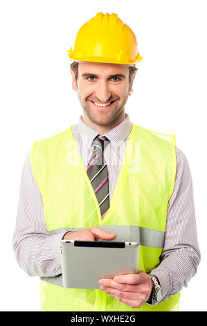 Young mechanical engineer using tablet pc Stock Photo