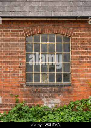 HARWICH, ESSEX, UK - AUGUST 12, 2018:  Exterior view of Window on old brick factory building Stock Photo