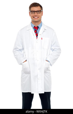 Stylish portrait of handsome male doctor posing with hands in pocket Stock Photo