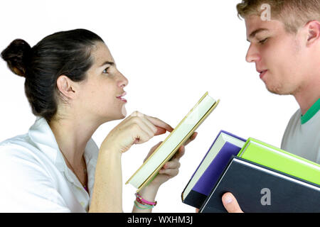 A couple of teens discussing study lessons Stock Photo