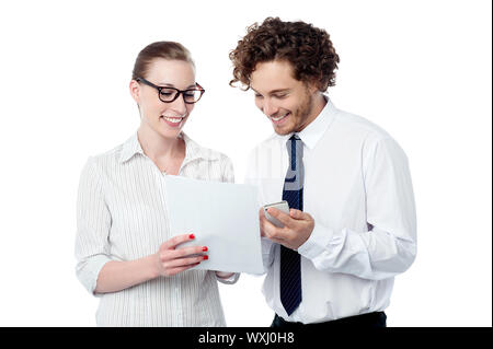 Business executives analyzing annual report Stock Photo