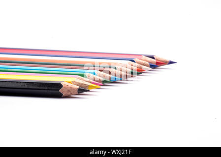Colored pencils arranged on an isolated white background Stock Photo