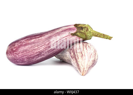 Two eggplants graffiti isolated over white background. The outer skin is striped with violet with ivory white. Copy space. Stock Photo