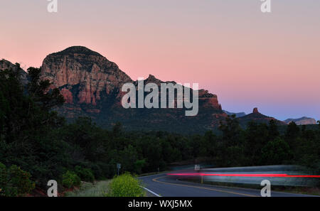 Light trails in rural Sedona at dusk, Arizona, United States Stock Photo