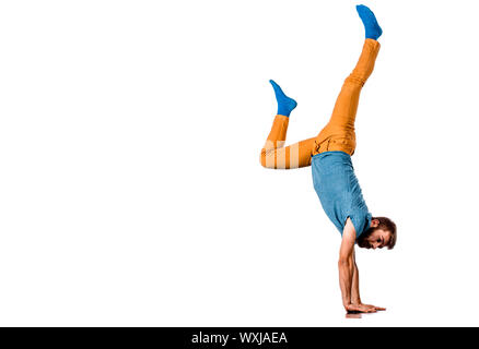 An urban guy is doing breakdance in the studio Stock Photo