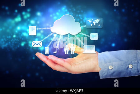 Cloud computing connectivity concept being held in a one persons hand on blue technology background Stock Photo