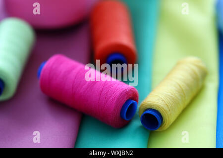 Multicolored threads on coils Stock Photo