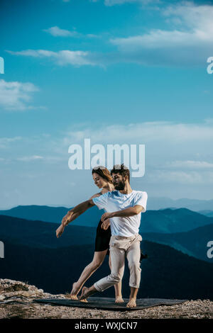 The two young modern ballet dancers training dance routine at the mountain hill Stock Photo