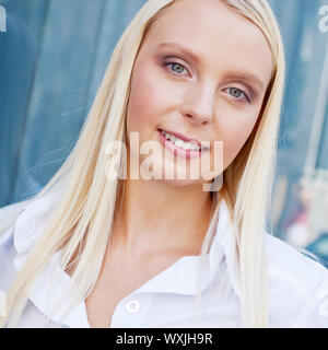 attractive young successful smiling business woman standing outdoor Stock Photo