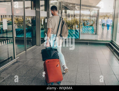 Handsome businessman going to departure lounge at airport Stock Photo
