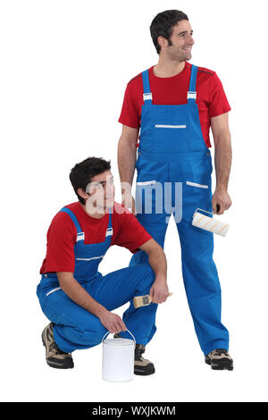 craftsman painter and apprentice working together Stock Photo