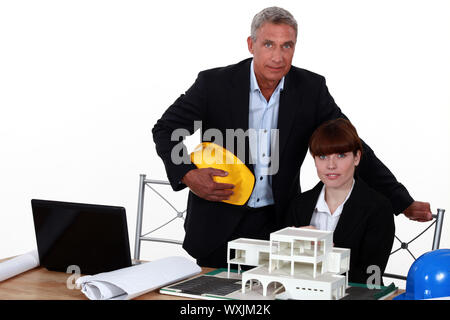 female architect in office with male counterpart Stock Photo