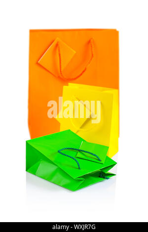 three colored paper bags isolated Stock Photo