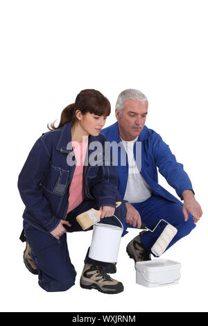 Decorator with young female apprentice Stock Photo