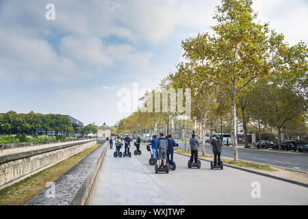 PARIS, FRANCE - 02 OCTOBER 2018: Tourists on segway in sightseeing Stock Photo