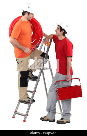 Two electricians working together Stock Photo