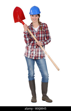 Woman with shovel Stock Photo
