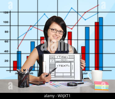 woman sitting in office and web page on clipboard Stock Photo
