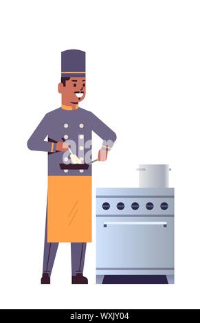 male professional chef using frying pan stirring food african american man restaurant kitchen worker in uniform standing near stove cooking concept Stock Vector
