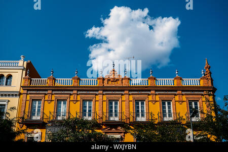 Seville, Spain - Sept 9, 2019: Early 20th-century building facade in San Fernando street in Andalusia Sevilla, Spain on a sunny summer afternoon Stock Photo