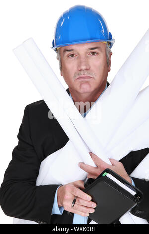 Senior architect holding plans and agenda Stock Photo
