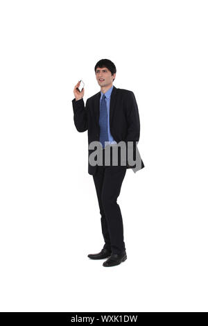 Businessman holding his mobile phone Stock Photo