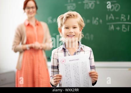 Pupil feeling happy after getting excellent mark Stock Photo