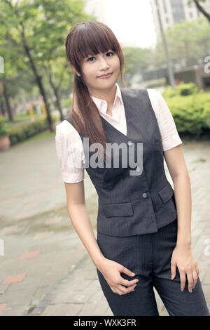 Attractive business woman, portrait in outside, Taipei, Taiwan, Asia. Stock Photo