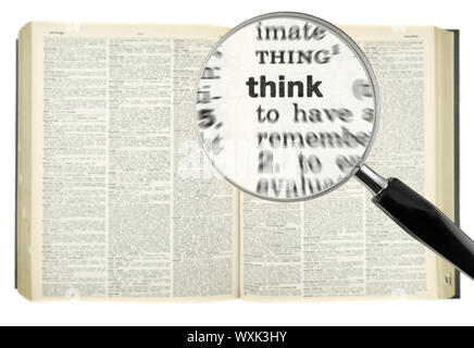 A magnifying glass on the word THINK on a dictionary. Stock Photo