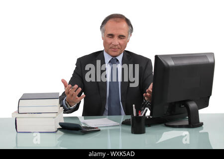 businessman working at his desk Stock Photo