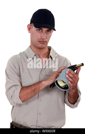 craftsman holding a welding torch Stock Photo