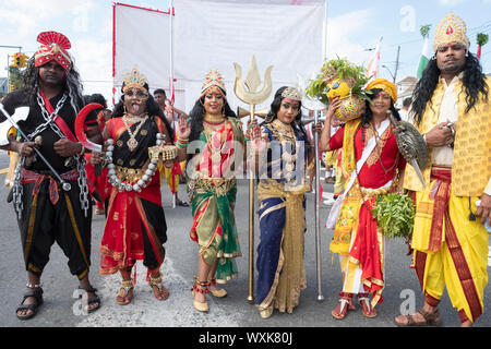 Devout Hindus dressed as Gods and Goddesses pose for a photo at the start of the Madrassi Parade for unity in the community. In South Richmond Hill, Q. Stock Photo