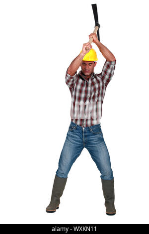 Construction worker with pickaxe Stock Photo