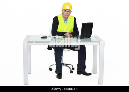 Architect sat by desk Stock Photo