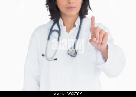Doctor pointing the finger in the air on white background Stock Photo