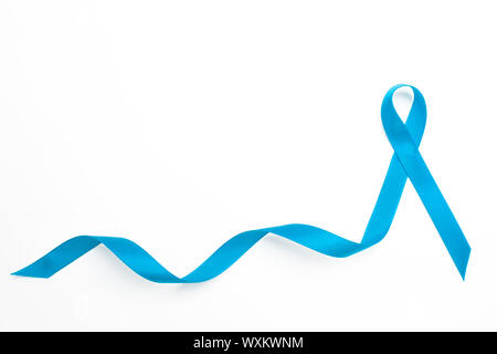 Blue awareness ribbon with trail on white background, Dark blue ribbon  symbolic for colon - colorectal cancer and Acute Respiratory Distress  Syndrome (ARDS) awareness on supporter's hand Stock Photo