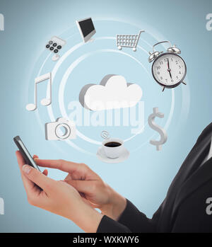 Businesswoman using applications on mobile phone and cloud computing on blue background Stock Photo