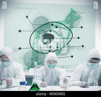 Lab workers experimenting with cell projection behind them Stock Photo