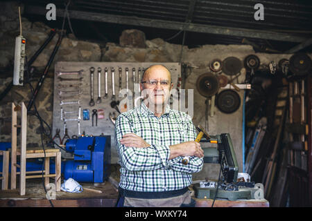 Carpenter in his workshop Stock Photo