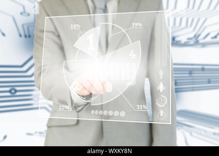 Businessman using transparent futuristic interface with circuit board background Stock Photo