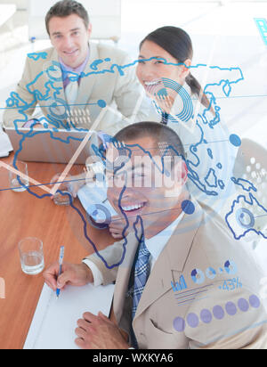 Overview of cheerful colleagues looking at blue map interface in a meeting Stock Photo