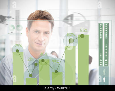 Businessman looking at green chart interface with statistics Stock Photo